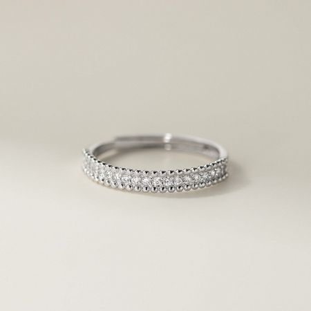 Close-up of a 925 sterling silver ring with a double row of beaded cubic zirconia, highlighting its minimalist style.