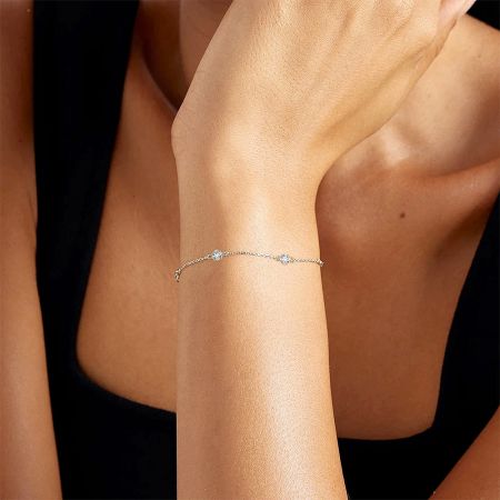 A product shot of the silver zircon bracelet against a neutral background.