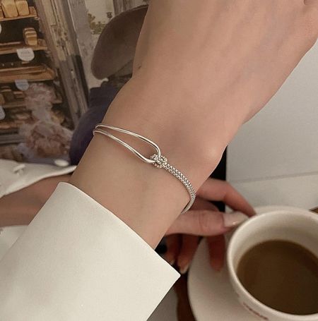 Close-up view of the 925 Sterling Silver Chain Cuff Bracelet worn on a wrist, showcasing its fit and shine.