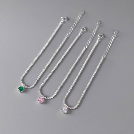 Four 925 silver bracelets from the wholesale set, each featuring a different colored zircon gemstone, displayed on a clean white background.