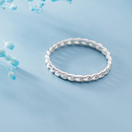 A beautifully crafted sterling silver ring with a detailed braided texture.