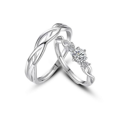 Detailed view of the braided design on the sterling silver promise rings, symbolizing unity and connection.