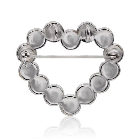 Back view of the rhinestone heart brooch showing the roller pin closure.