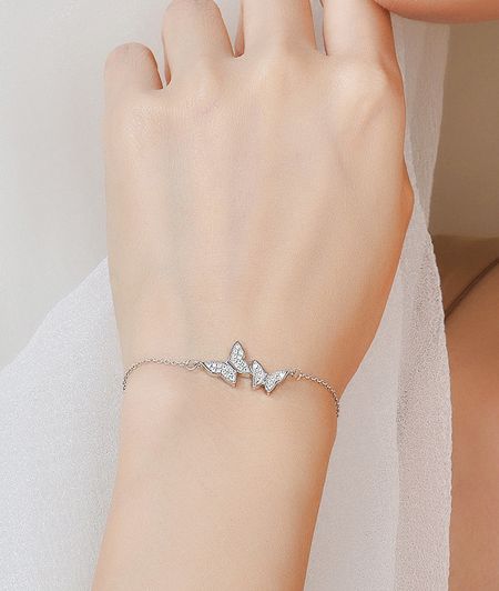 A model wearing the elegant 925 sterling silver butterfly bracelet.