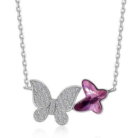 Side view of the twin butterfly pendant necklace highlighting the pink Swarovski crystal.