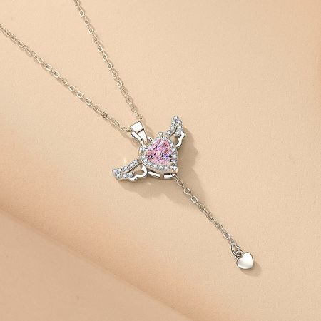 The angel wing heart necklace displayed on a neutral background.
