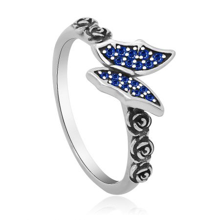 Angled view of the sapphire butterfly ring, highlighting the sparkle of the blue gemstones.