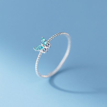 Detailed view of the 925 silver butterfly ring with vibrant blue gemstones.