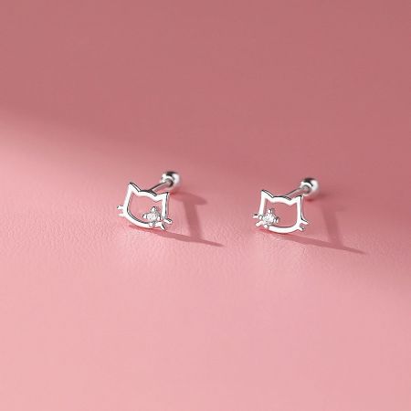 Sterling Silver Cat Ear Stud Earrings with Cubic Zirconia - A close-up view of sterling silver cat ear stud earrings, each featuring a sparkling cubic zirconia stone at the center, displayed on a textured surface.