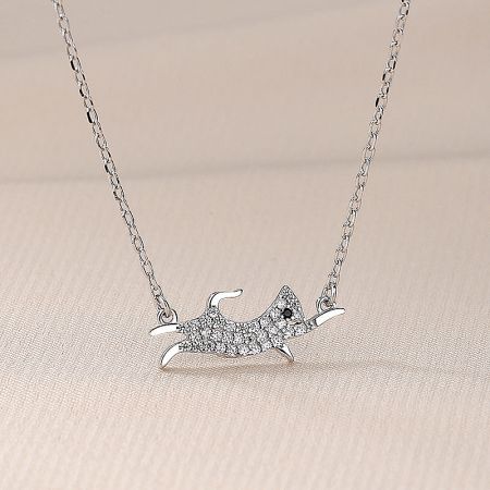 Detailed view of the 925 sterling silver dog pendant necklace, highlighting the intricate cubic zirconia details.