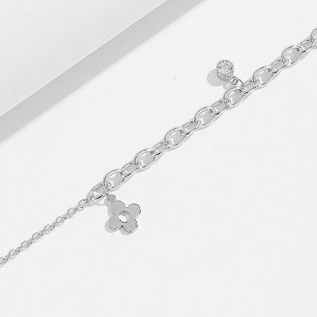 A silver chain bracelet featuring a decorative flower charm and a toggle clasp.