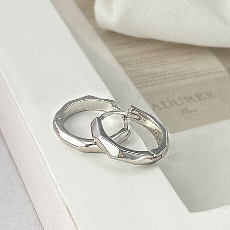 Side profile of the sterling silver octagon huggie earring.