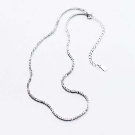 Detailed view of the sterling silver tennis chain, showing the intricate setting of the 2mm zircons.