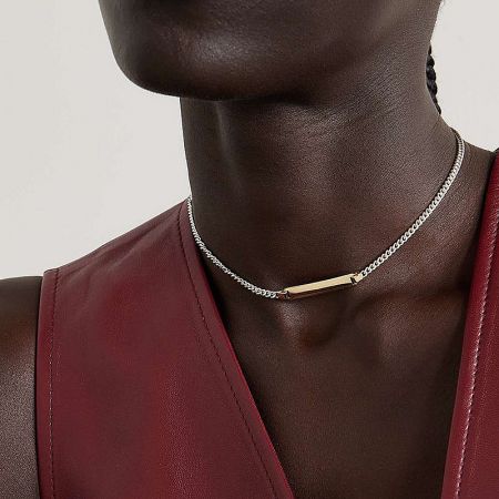 A woman wearing the hypoallergenic stainless steel bar pendant necklace.