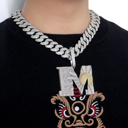 Custom Letters Hip Hop Necklace - A model wearing a custom letters hip hop necklace with a large silver 'M' pendant, showcasing the bold style.
