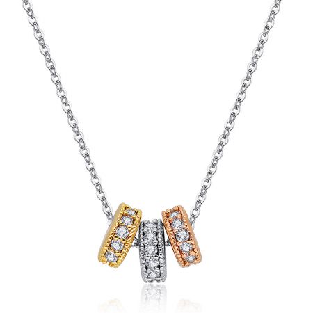 Detailed view of the cubic zirconia stones on the three-tone pendant.