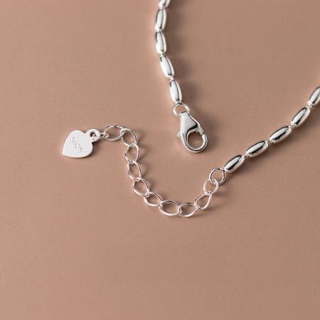 The extension chain and clasp of the sterling silver bracelet, ensuring an adjustable and comfortable fit.