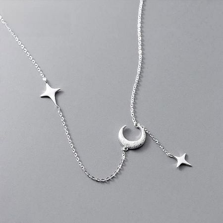 A clear view of the 925 silver necklace with its crescent moon and star design.