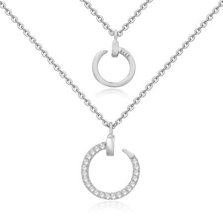 Close-up view of the rhodium-plated necklace pendants with cubic zirconia detailing.