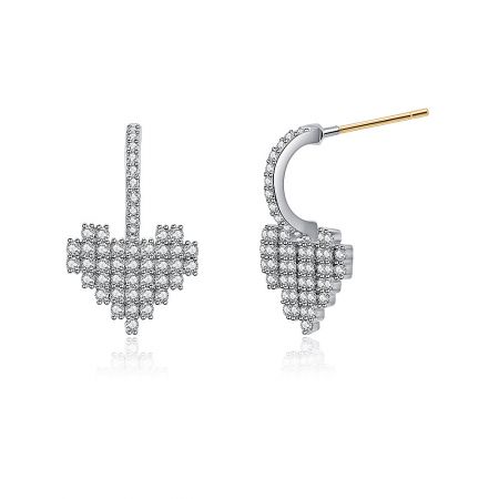 Detailed close-up of the sparkling clear stones on the silver cross earrings.