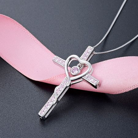 925 Sterling Silver Cross Pendant Necklace - A detailed view of the 925 Sterling Silver Cross Pendant Necklace, featuring a delicate heart-shaped center with pink cubic zirconia, showcasing its fine craftsmanship.