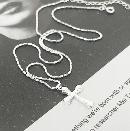 A clean product photo of the 925 sterling silver cross necklace on a delicate chain.