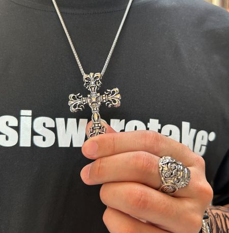 The Gothic Cross Pendant displayed alongside a matching ring to showcase a complete set.