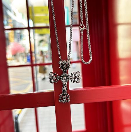 Angled view of the ornate stainless steel Gothic Cross Pendant.