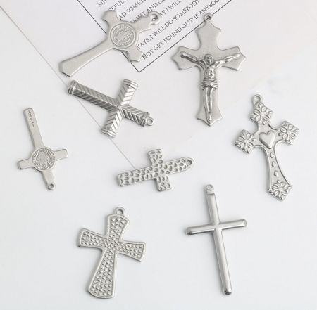 Detailed view of various silver cross pendants available for custom orders.