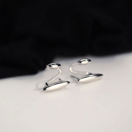 Elegant curved oval sterling silver cuff stud earrings, showcasing a modern aesthetic.