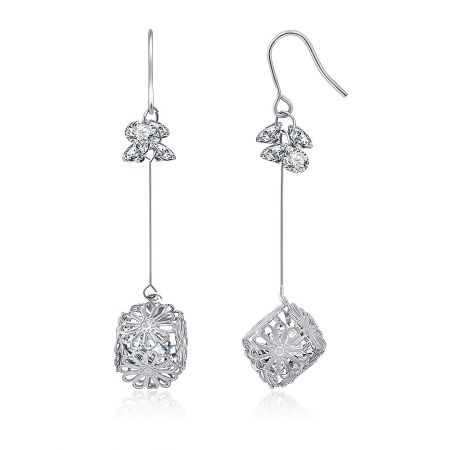Detailed view of the Daisy Drop earrings' filigree design and CZ stones.