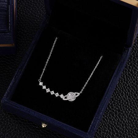 The celestial necklace set presented in an elegant blue gift box.