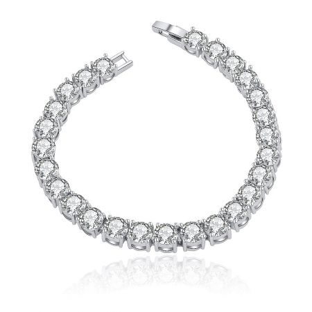 Tennis Wrist Candy Bracelet - A stunning Tennis Wrist Candy Bracelet featuring a continuous line of brilliant round cubic zirconia stones set in a rhodium-plated brass band, showcasing its elegant design and sparkle.