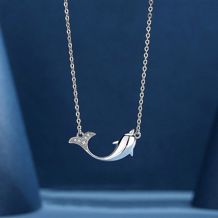 Detailed view of the sterling silver dolphin pendant necklace.