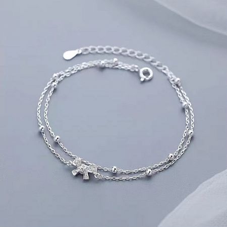 The double-strand design of the 925 silver bow bracelet displayed on a white background.