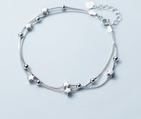 925 Sterling Silver Star Bracelet - A close-up view of the 925 Sterling Silver Star Bracelet, showcasing its double-strand design with delicate star and ball charms.