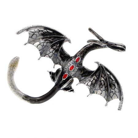 Silver dragon brooch featuring striking red gemstone accents.