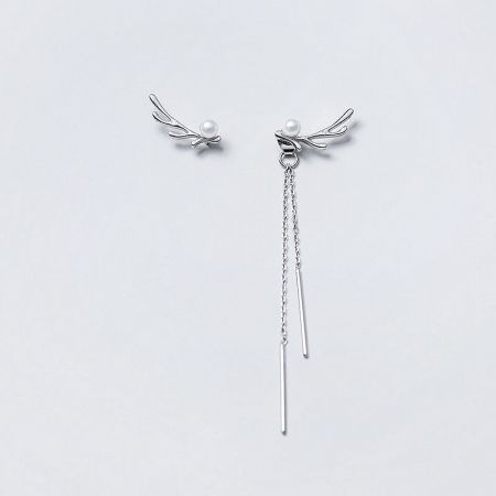 Studio shot of the 925 sterling silver version of the asymmetrical antler pearl drop earrings.
