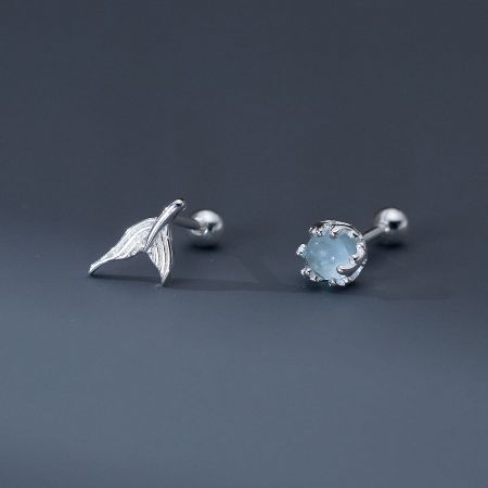 Close-up of the intricate leaf and gemstone designs within the earring set.