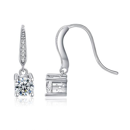 Close-up detail of the clear cubic zirconia stone on the rhodium-plated dangle earrings.