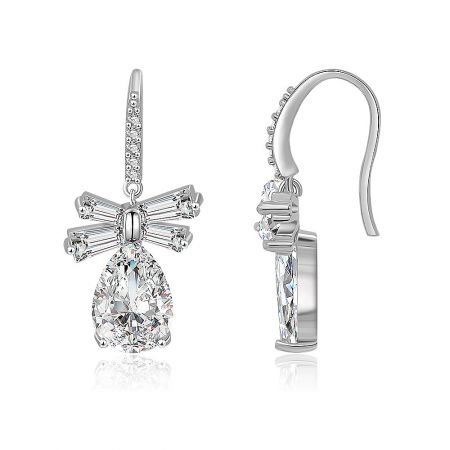 Side view of the White CZ Oval Drop Bow Earrings, showcasing the modern cross-shaped structure and brilliant gemstone.
