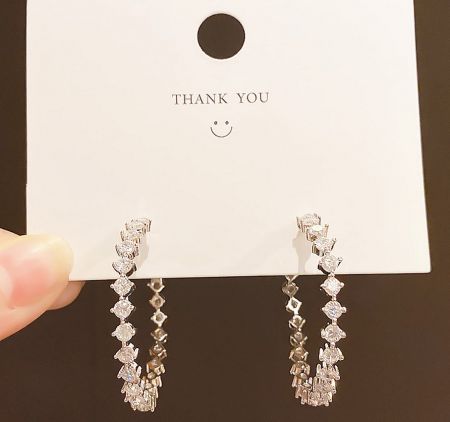 The 40mm CZ hoop earrings displayed on a 'THANK YOU' card, highlighting their gift-ready presentation.