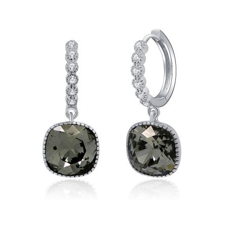 Angled shot of the sterling silver drop earrings, displaying the intricate details of the crystal setting and the black diamond.