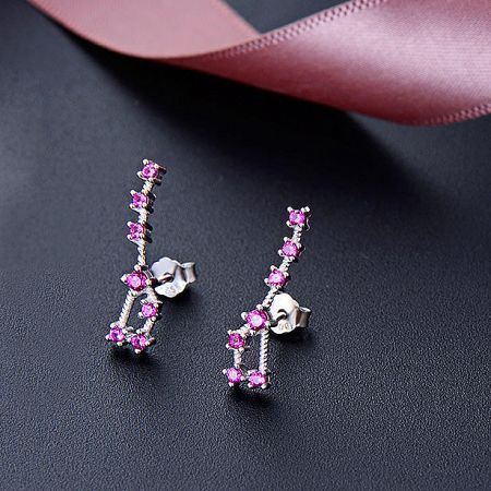 Close-up of the pink CZ stone Big Dipper stud earrings in 925 sterling silver.