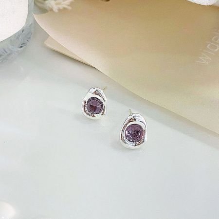 A pair of elegant sterling silver stud earrings with deep purple opal gemstones.