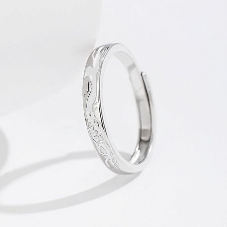 A single adjustable silver ring showcasing its intricate engravings.