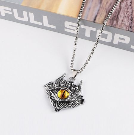 Detailed view of the silver evil eye pendant, highlighting its intricate design.