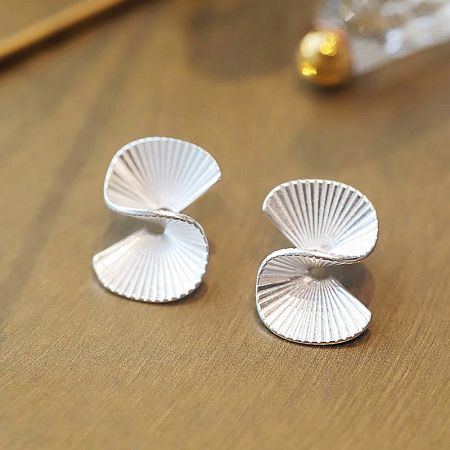 Detailed view of the double-layered fan design of the sterling silver earrings.