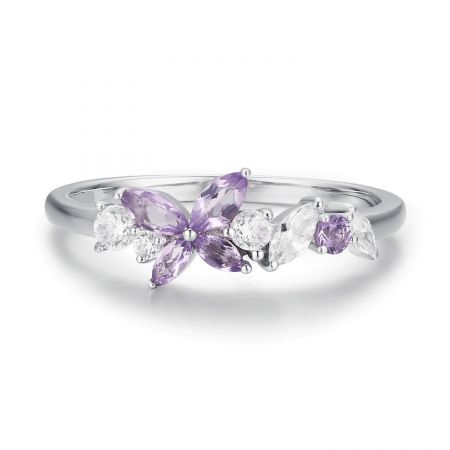 Top-down view of the silver butterfly ring with its purple amethyst and white crystal accents.