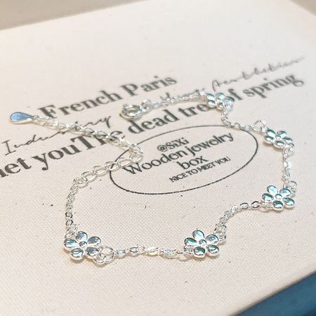 Clean studio shot of the sterling silver floral bracelet, highlighting its craftsmanship.